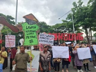 Ilustrasi Aksi unjuk rasa petani menuntut penghentian kriminalisasi dalam kasus konflik agraria.